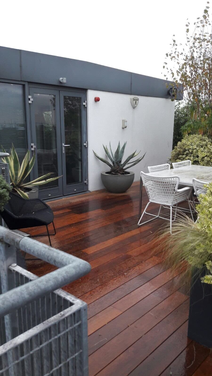Decked terrace with planters and outdoor seating