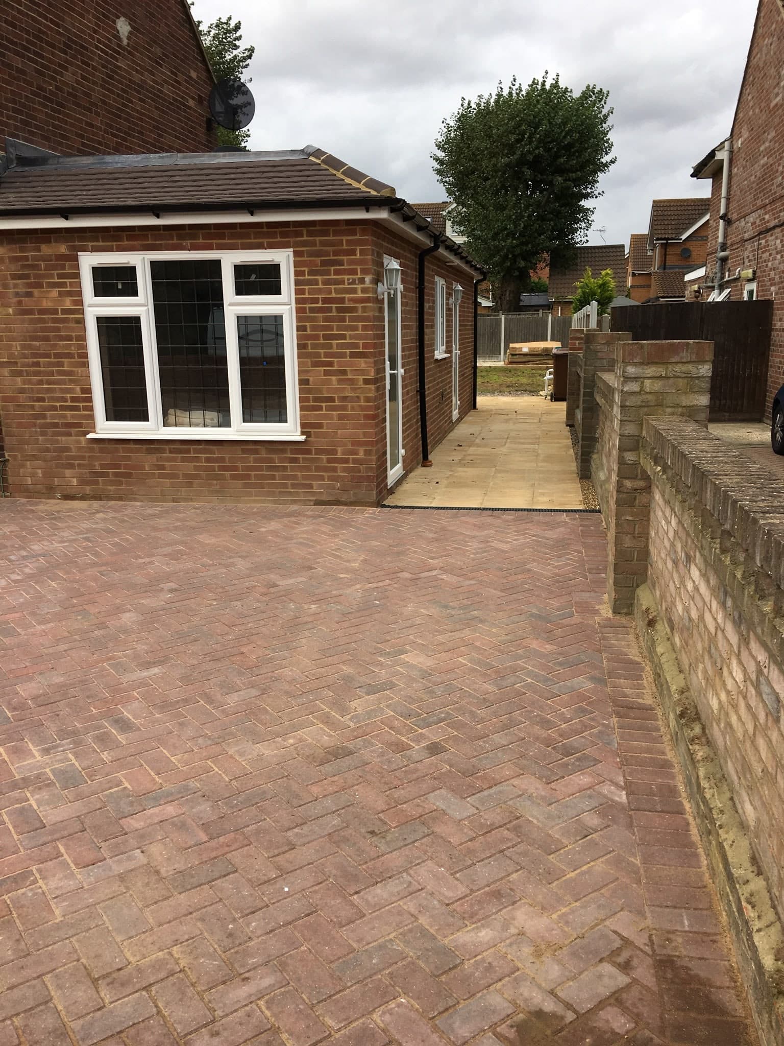 New block-paved drive and side extension