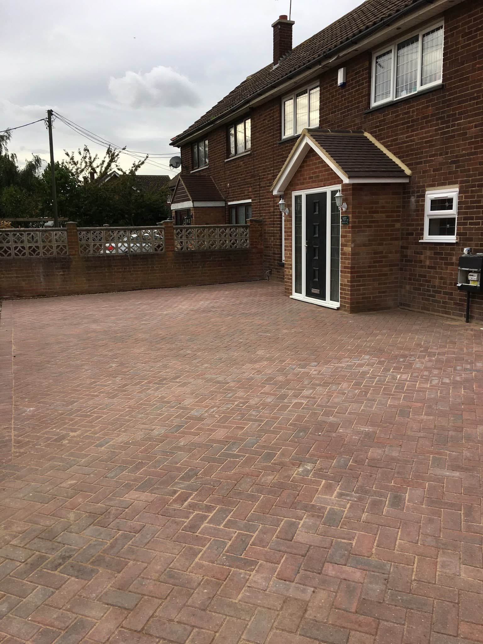 Block-paved driveway in front of the house