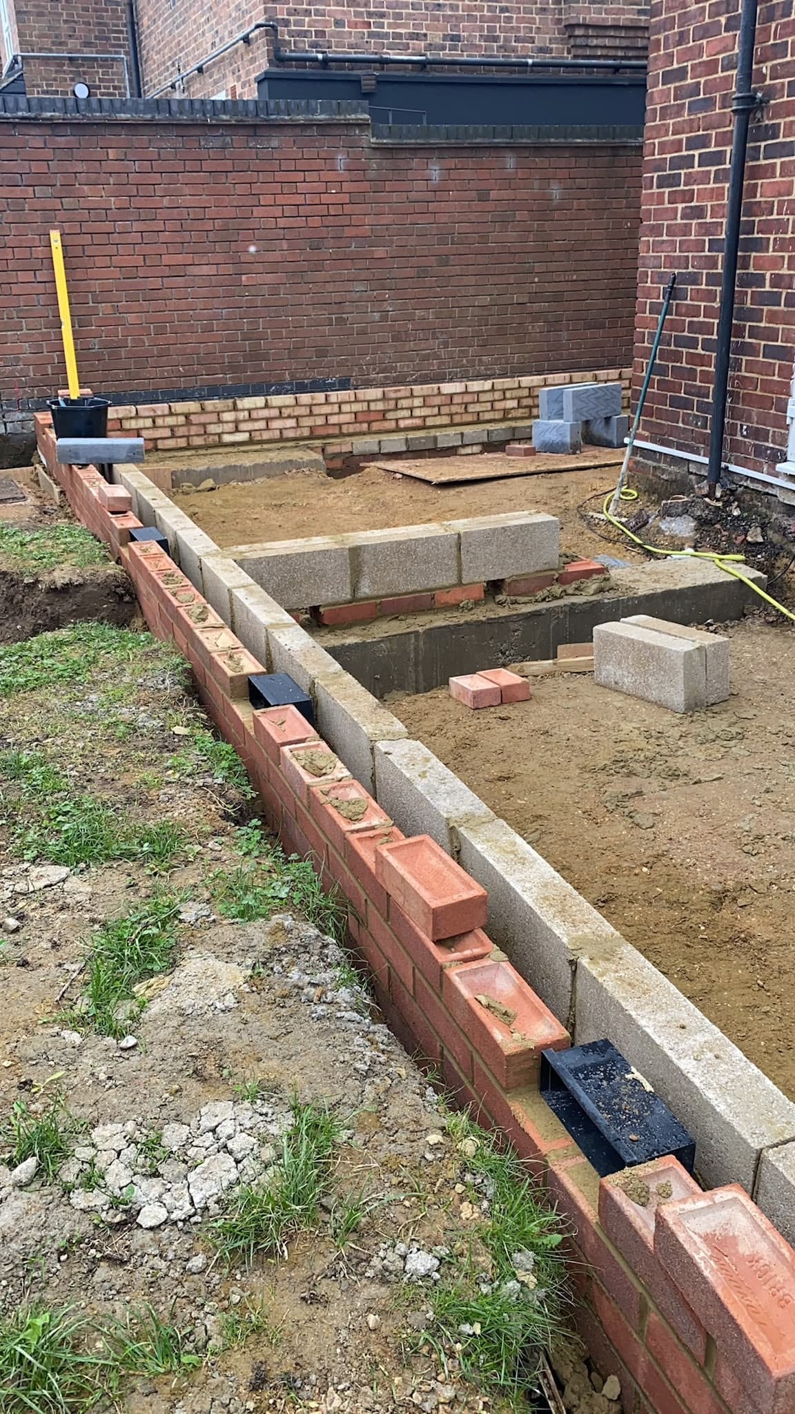 Footings brought up in blockwork and brick to damp-proof level