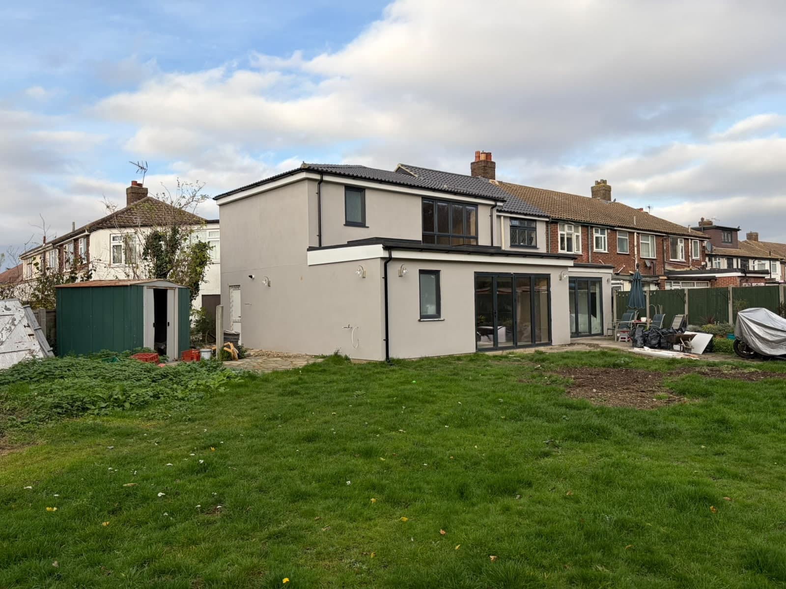 Finished rear extension and loft dormer on a semi, rendered white