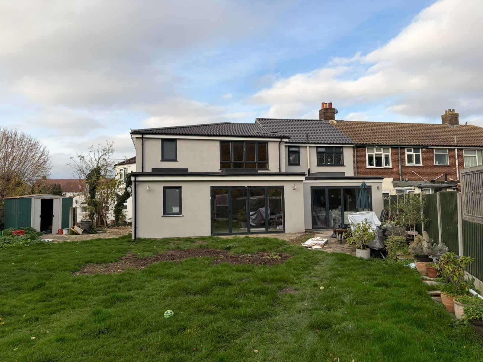 Rear extension with sliding doors and a dormer above