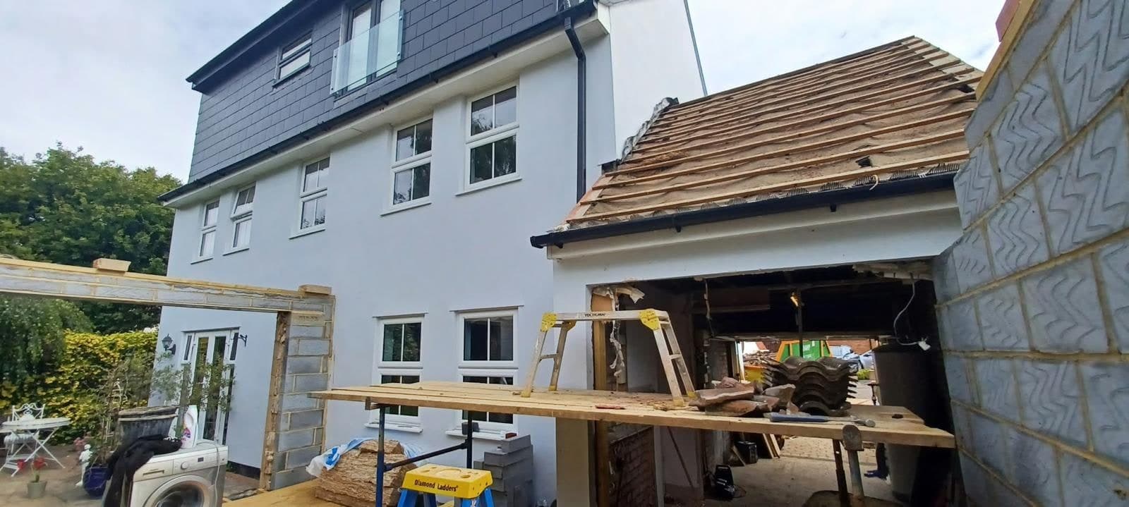 Gable extension roof timbers going up against the house