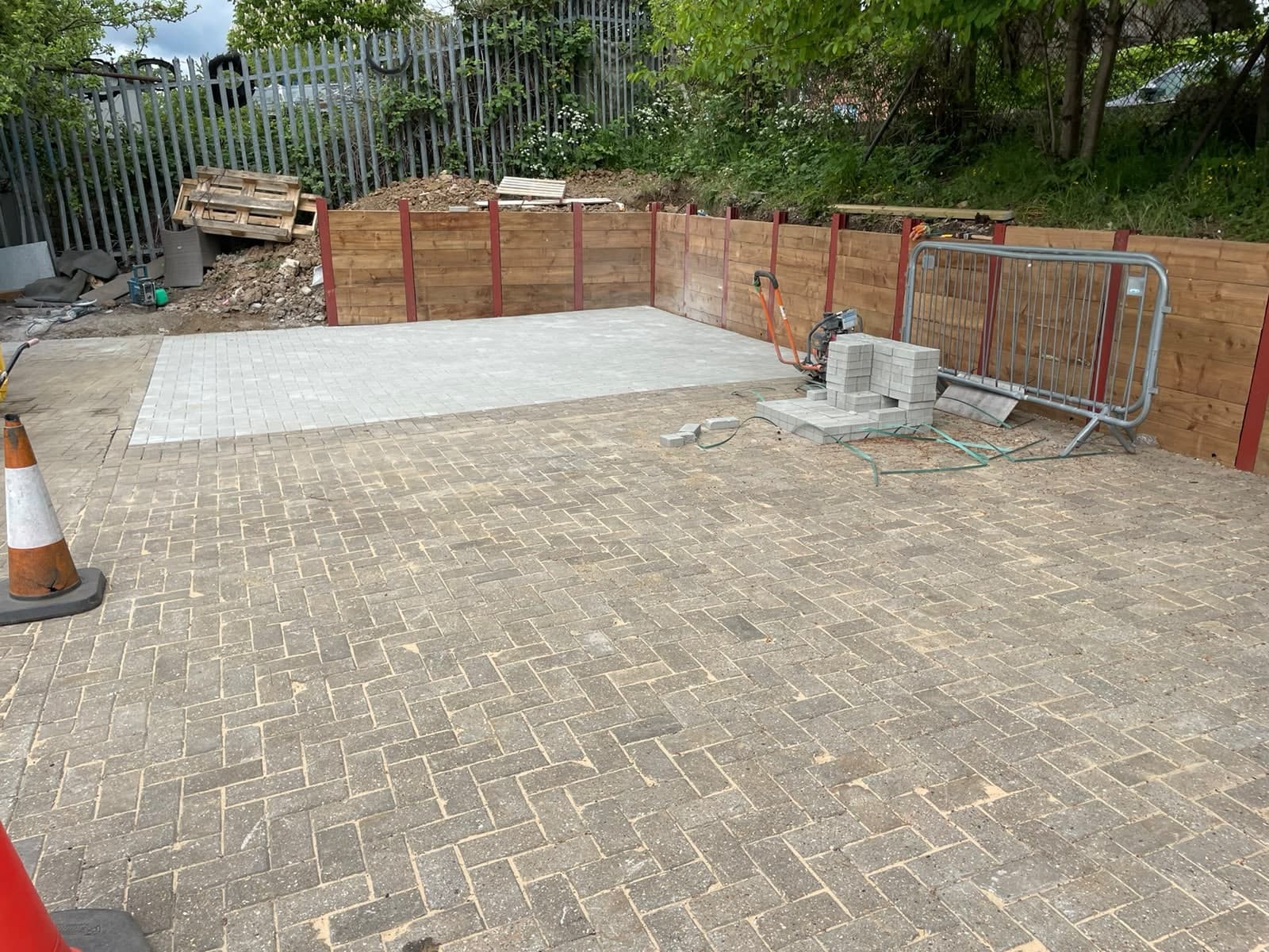 Block paving laid up to the new retaining wall