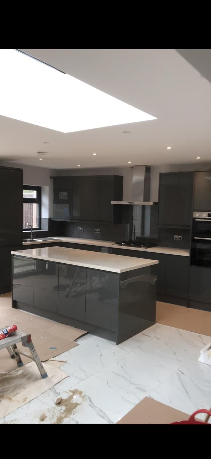 Grey gloss kitchen with island and integrated appliances