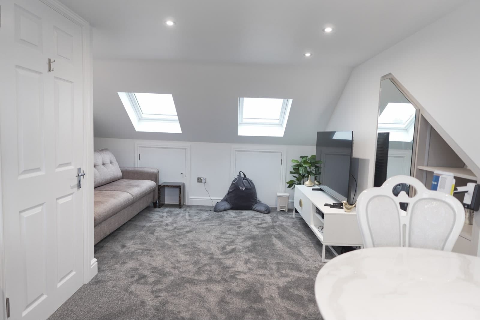 Loft bedroom with rooflights and a built-in eaves cupboard