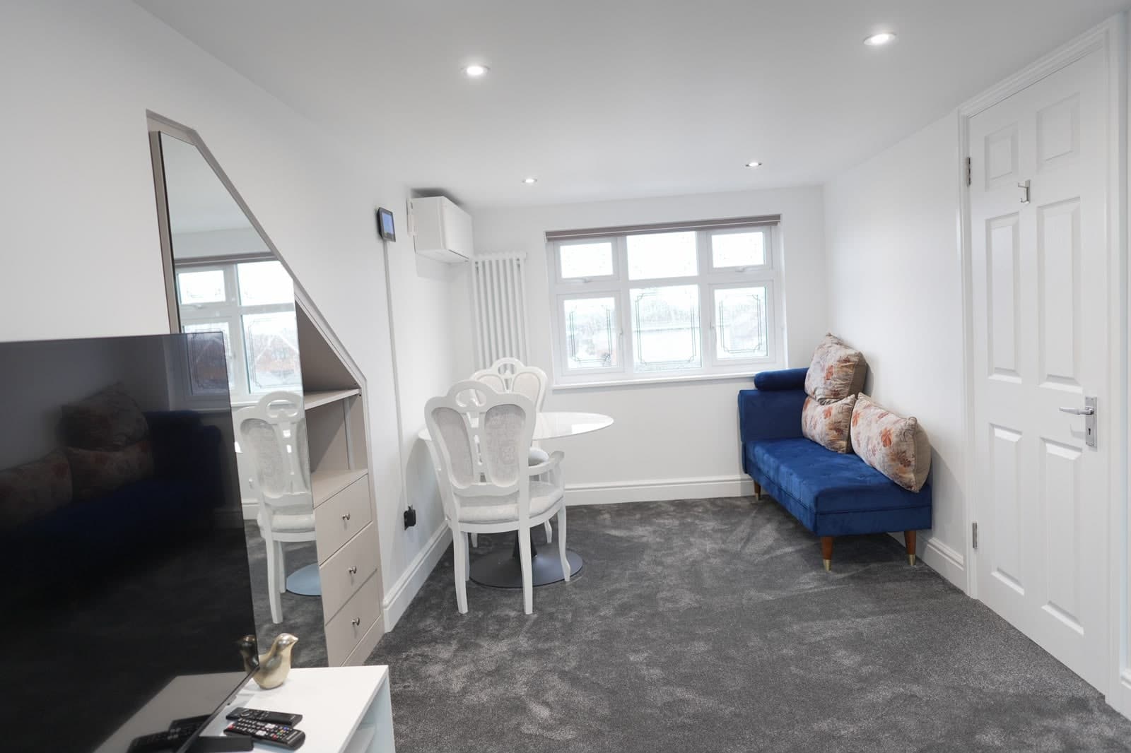 Loft room with dormer window and sofa
