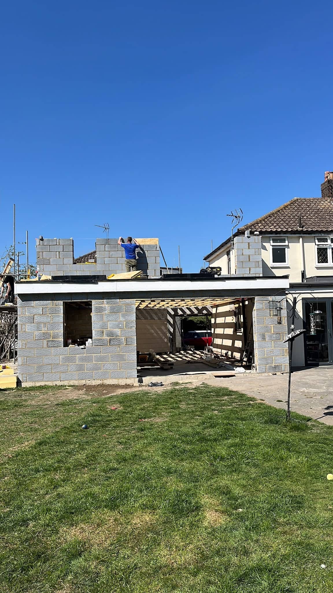 One of the team fixing the roof timbers